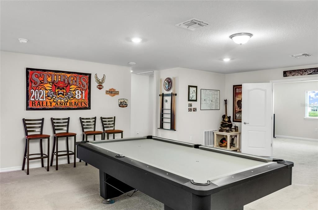 Loft area perfect for a pool table and games area.