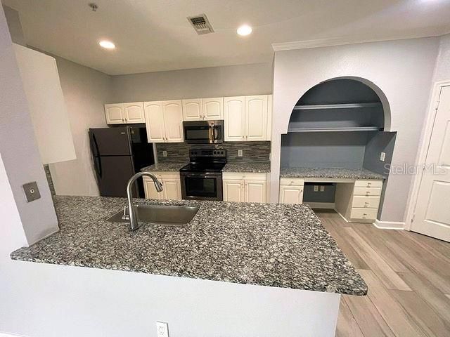 Kitchen with granite breakfast bar