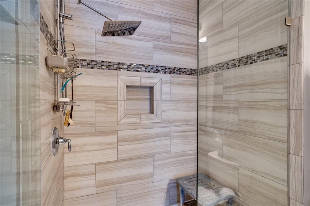Primary Shower with high end finishes and listello tiles