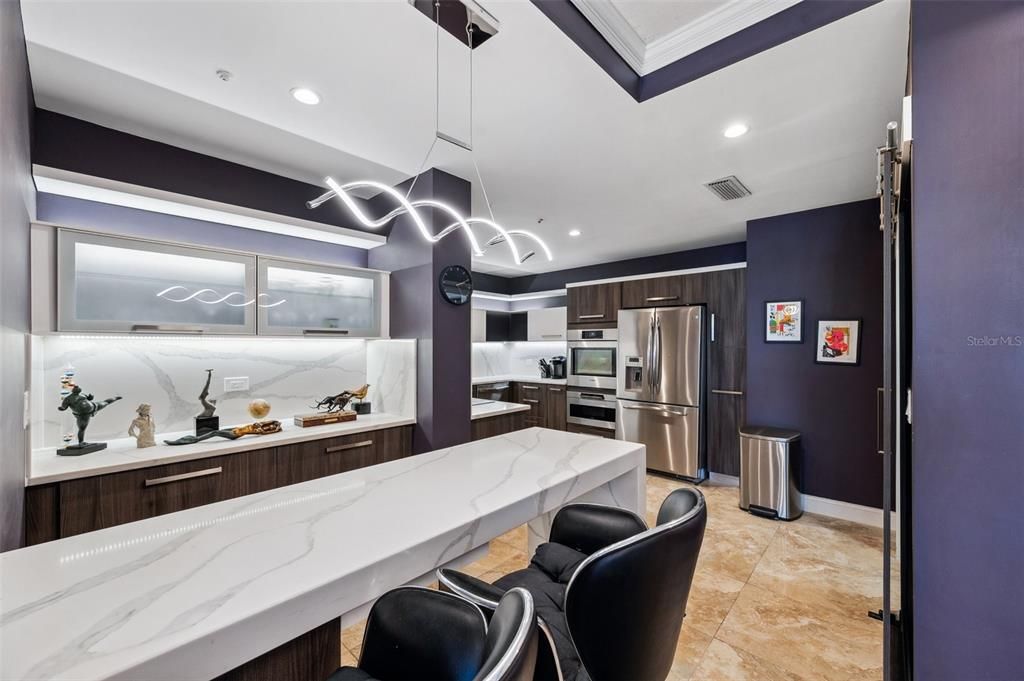 Stunning sitting area with wine fridge, porcelain tiles all around