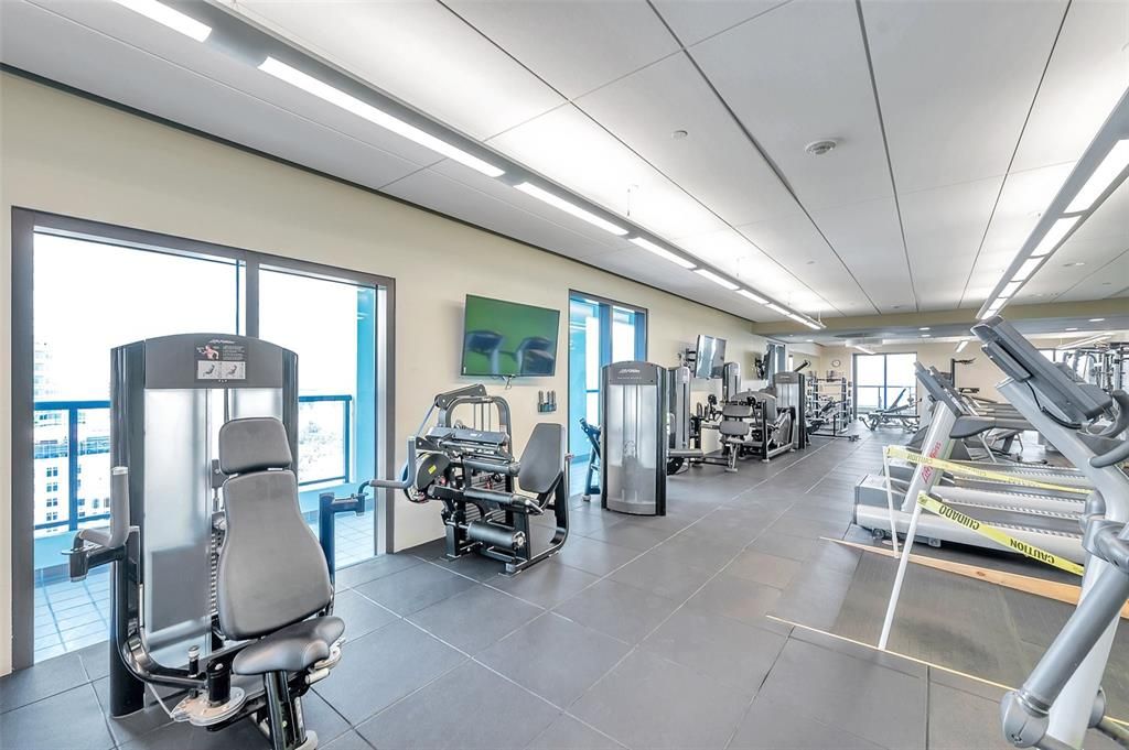 Large renewed fitness area on the 28th floor, next to sauna, outdoor covered walking path, library, and much more !!