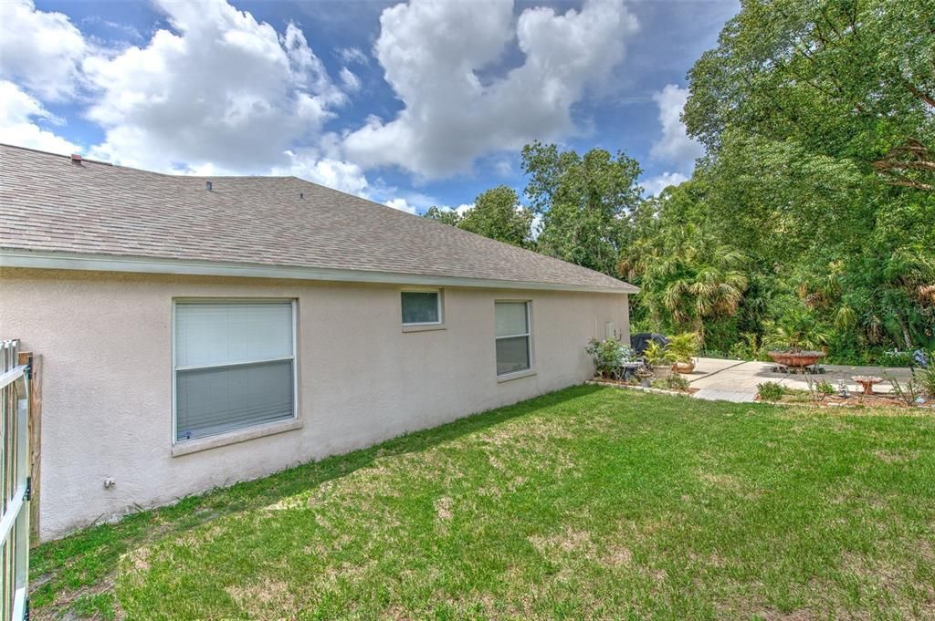 Large open backyard space on side of home