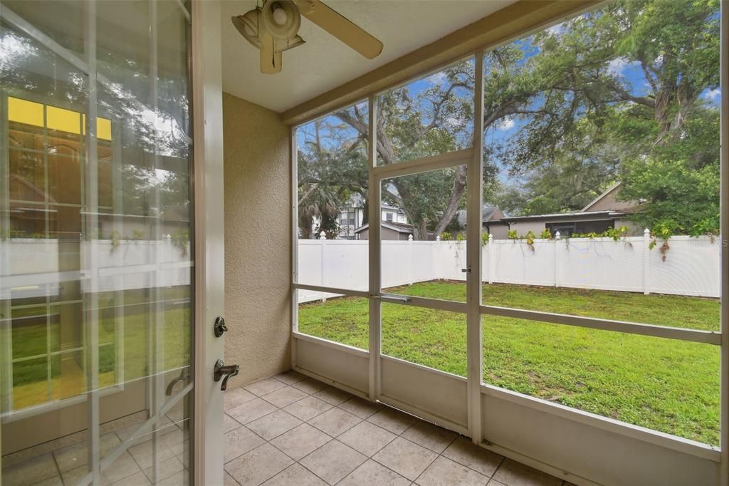 Back covered, screened-in patio