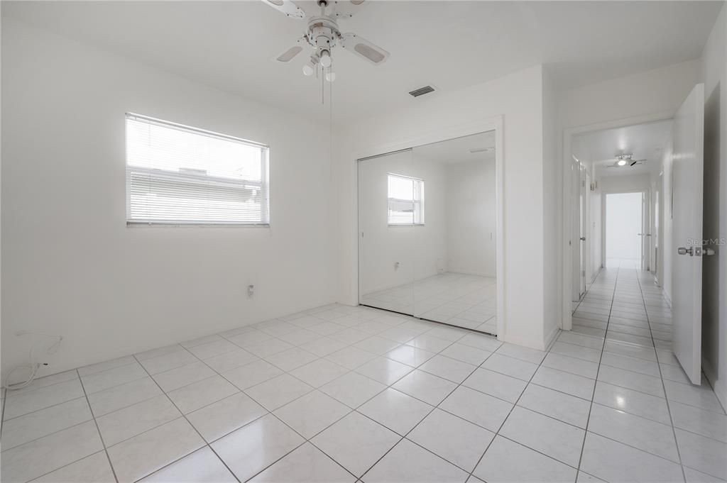 Large kitchen with stainless steel appliances, granite countertops, and pantry closet