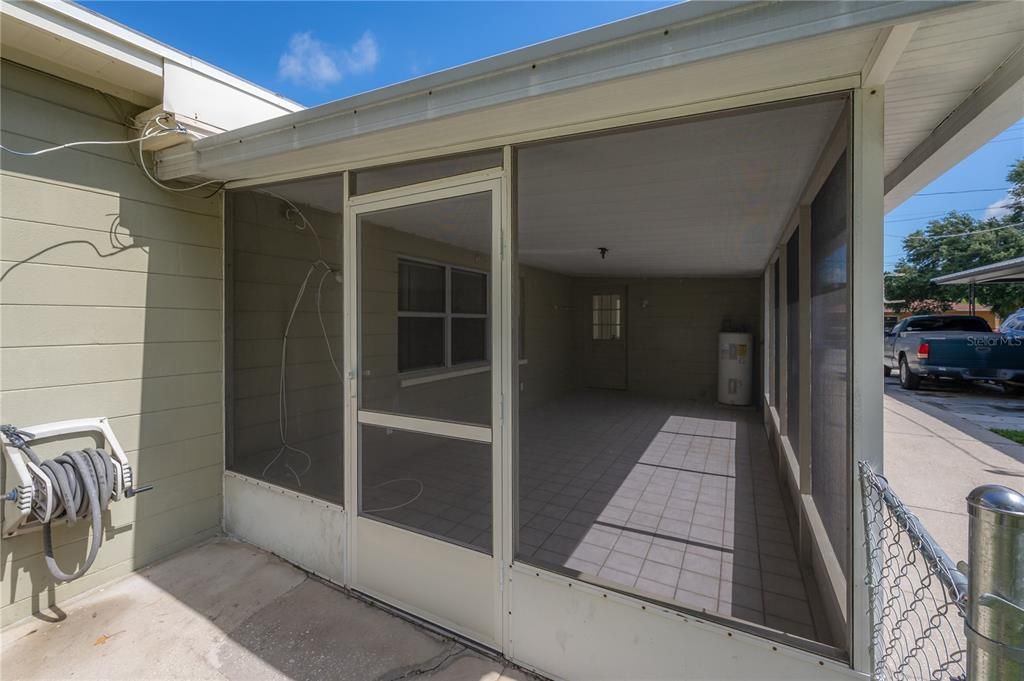 Patio leads to the rear yard and LARGE storage shed/workshop space