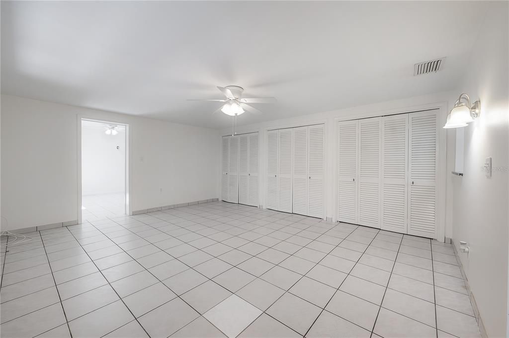 Large kitchen with stainless steel appliances, granite countertops, and pantry closet