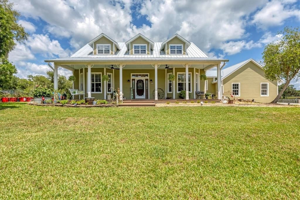 Your Florida Country Home awaits! High ceilings, on five fully-fenced acres with gate at driveway.