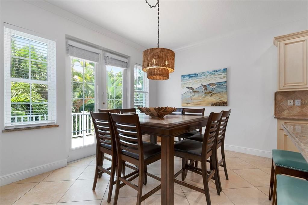 Open concept dining area with doors to the balcony