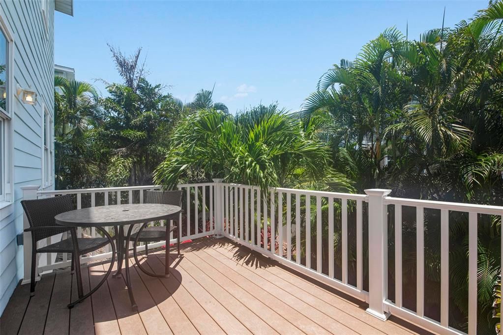 Balcony off of living area overlooking the pool