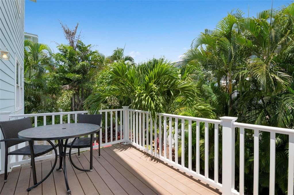 Balcony off main living area overlooking pool deck