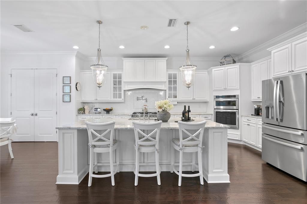 The spacious and open kitchen with an oversized island with storage