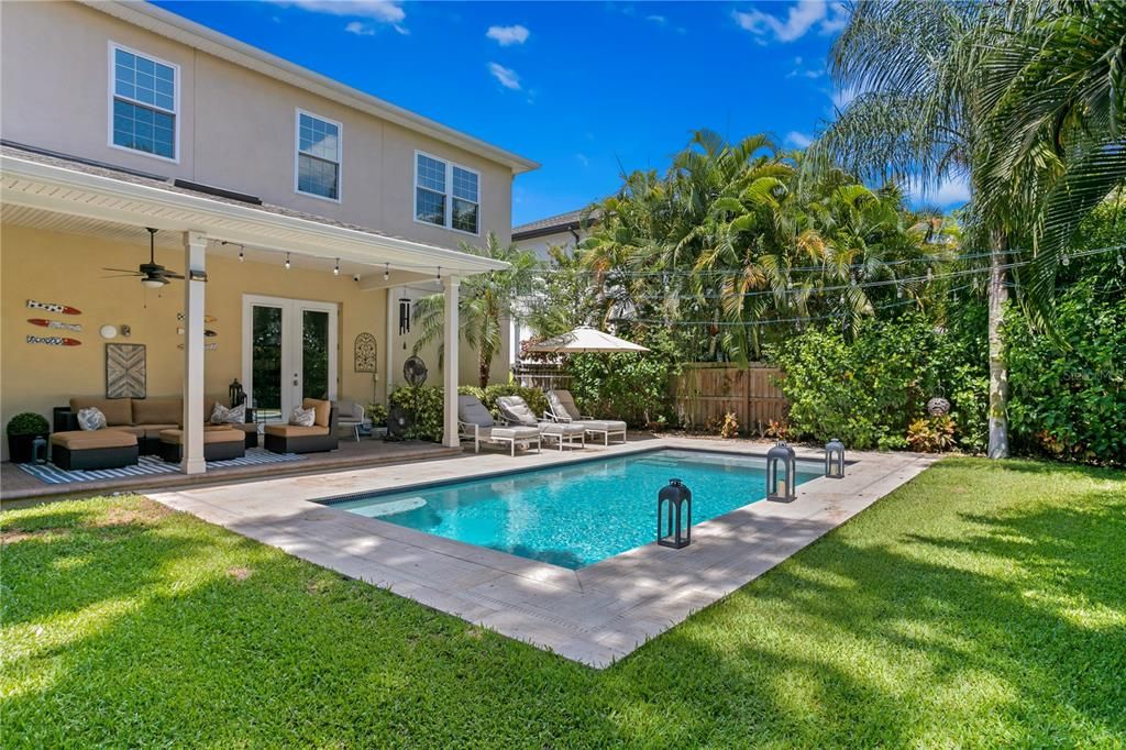 This home sits on a large lot where the backyard encompasses both a pool and greenery for a soccer net, playset, or space for our furry family members to play.