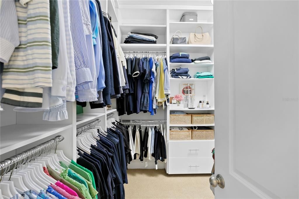 The generously sized and organized primary closet space