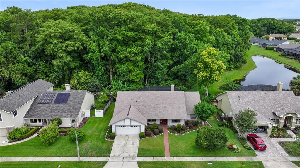 Enjoy the great view of the woods and lake located behind the home.