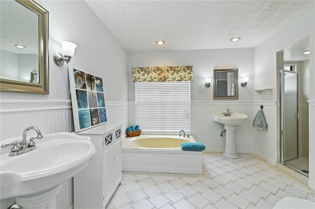 A view of the garden tub and separate shower stall.