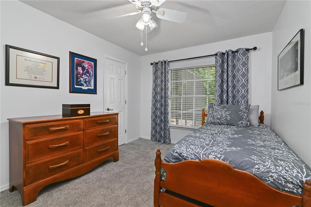 A guest bedroom located toward the back of the home.