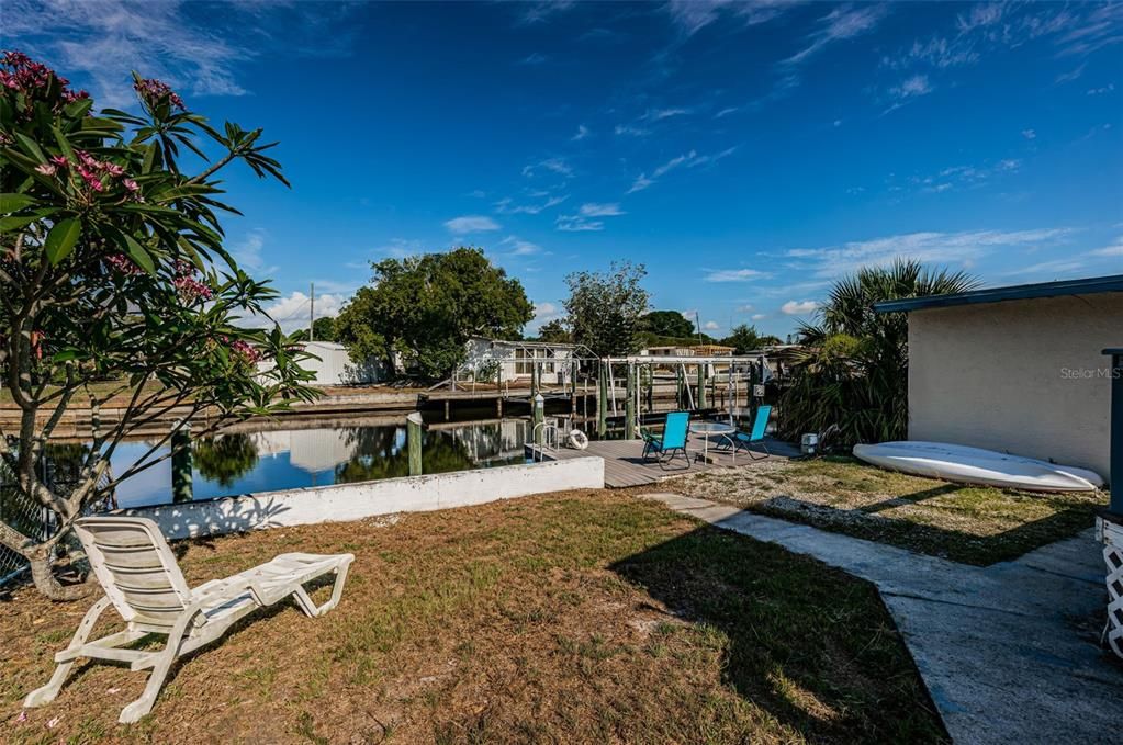 Spacious yard. Waterfront on saltwater canal.