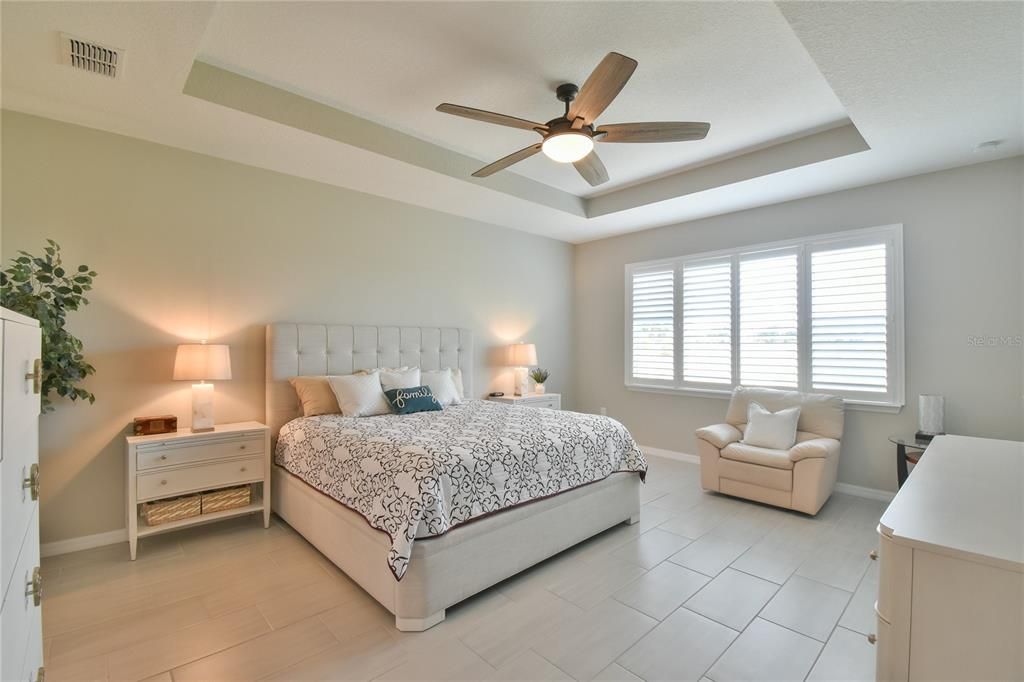 Large Primary bedroom, recessed ceilings and porcelain tile floors