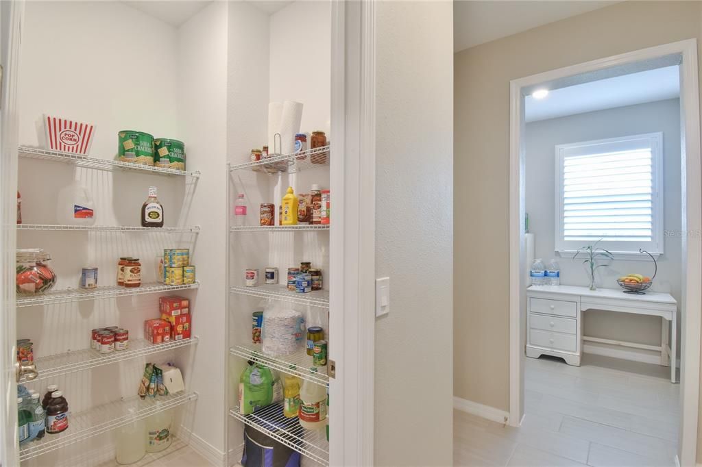 Walk in pantry and view of craft room