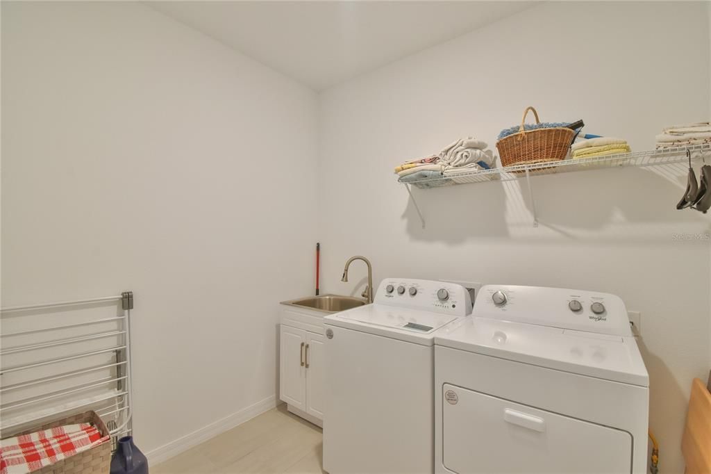 Laundry room with wash basinguest bedroom