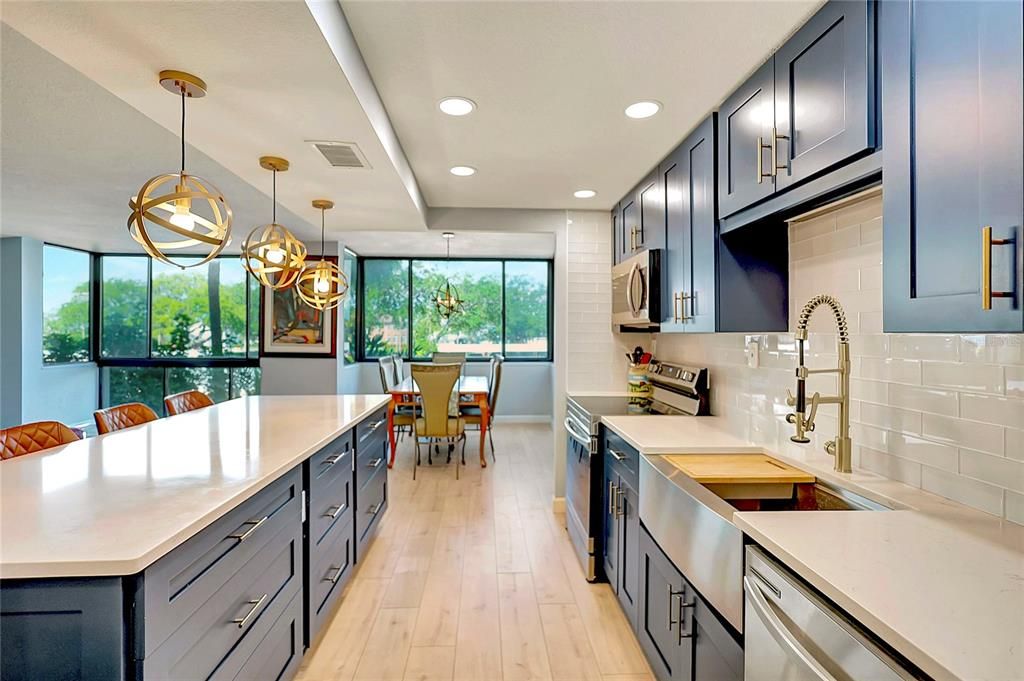 Enjoy cooking in this condo's kitchen while still taking in the views from the large windows nearby.