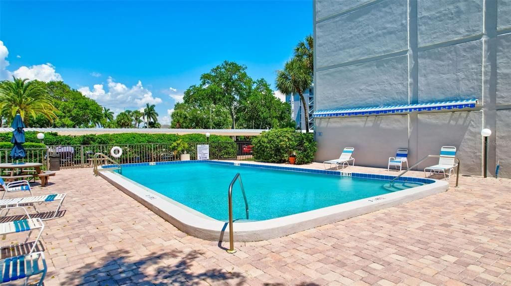 Residents can unwind and cool off in the private community pool, offering a relaxing retreat just steps away from their condo.