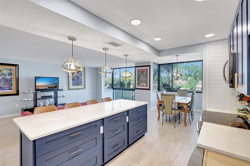 Whether you're cooking meals or enjoying casual dining at the island table, this kitchen is both stylish and functional, making it a central part of your comfortable waterfront living.
