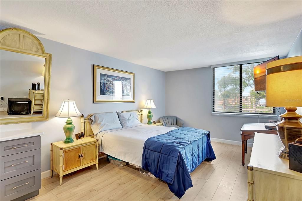 Step into this peaceful sanctuary within the condo, where the master bedroom offers a cozy atmosphere.