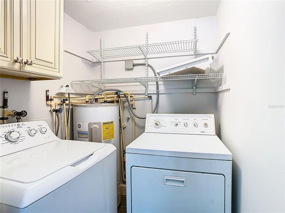 Laundry room in primary bedroom.