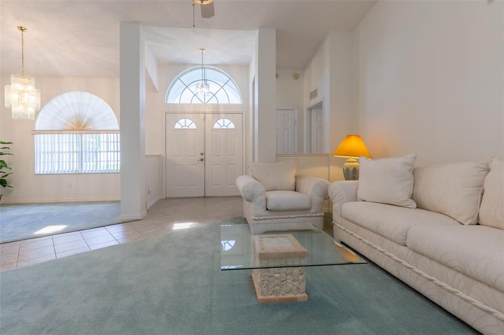 The entry Great Room has high ceilings, Sky Lights, an Entry Foyer