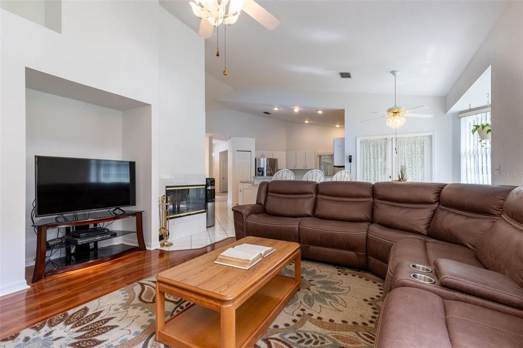 high ceiling alcove, Ceiling Fan, TV Nook and wood-burning Fireplace!