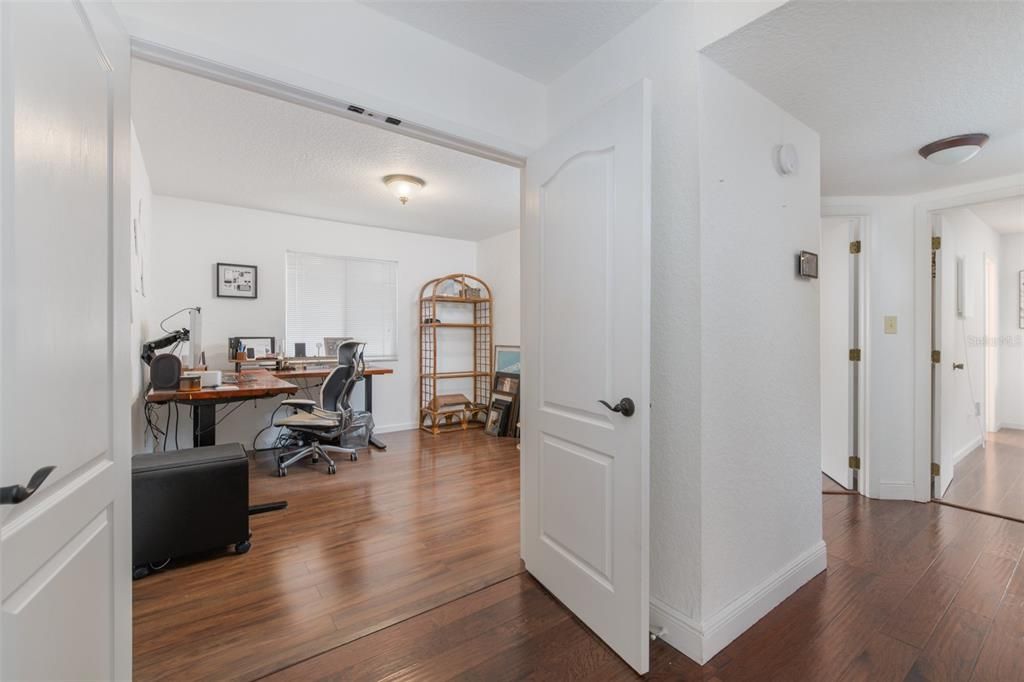 Double doors open to a secondary bedroom