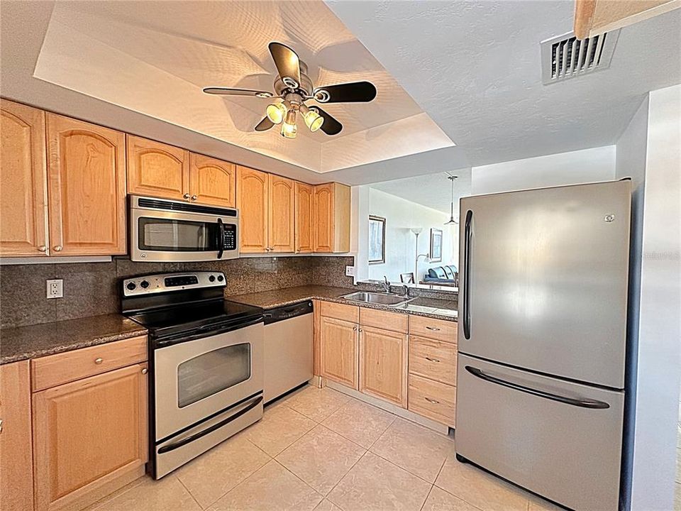 Fully stocked kitchen with stainless steel appliances