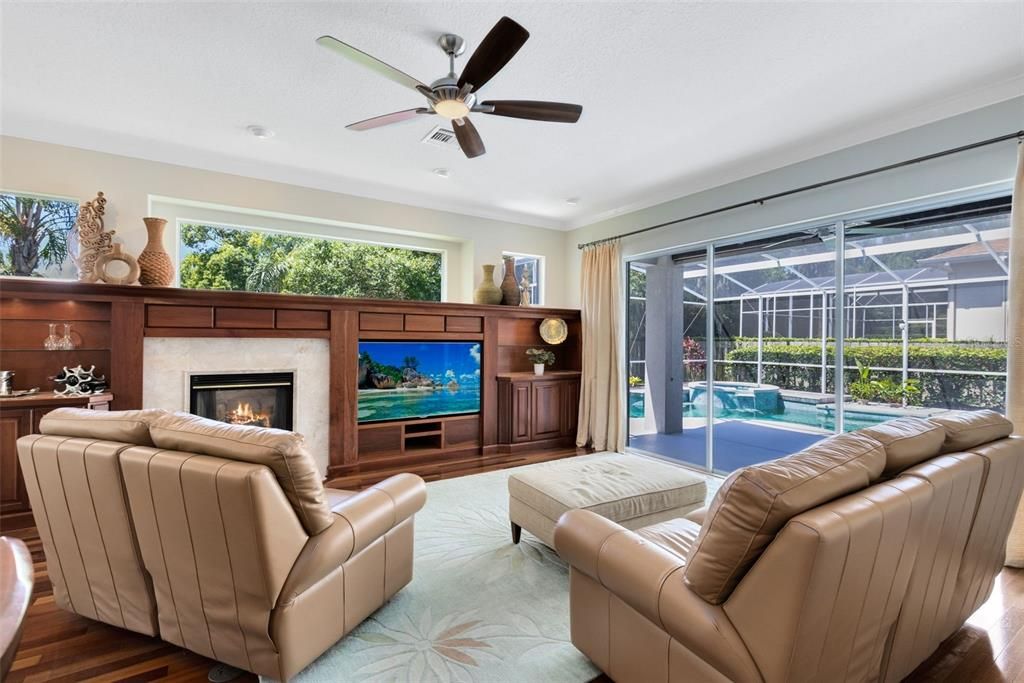 Family room opens out to the pool through glass sliding doors