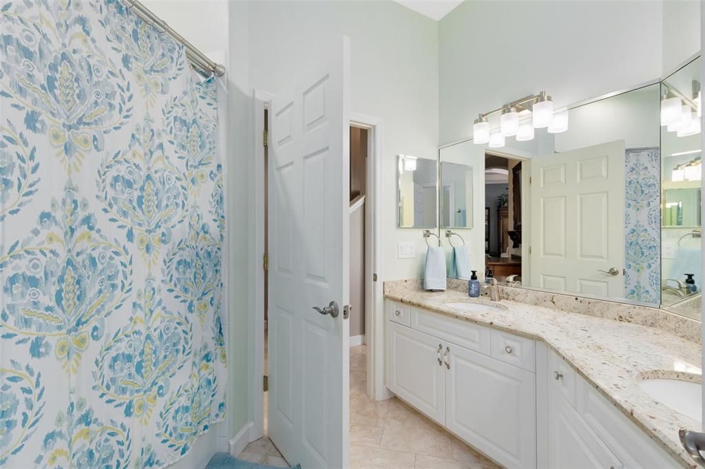 Jack-n-jill bathroom between bedrooms 2 & 3, tub shower, dual sinks