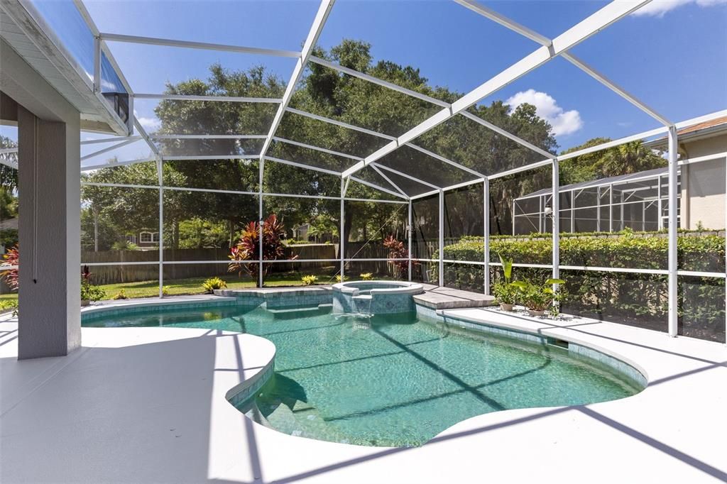 Screened in pool, just painted pool deck and updated pavers around the spa