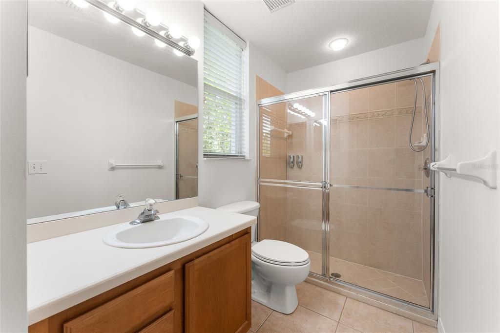 Sunken Garden Tub With Lots of Natural Light & Separate Water Closet