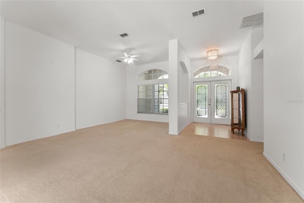 Formal Living Room With Views to the Pool & Kitchen