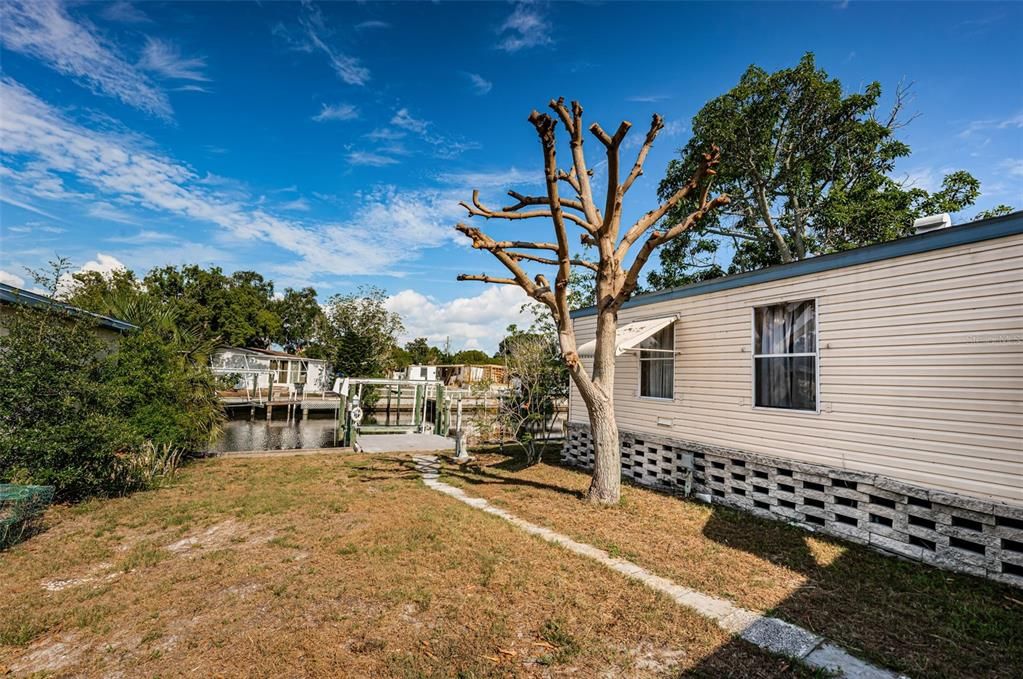 Spacious yard leading down to the water, where you can catch the setting sun from your very own dock!