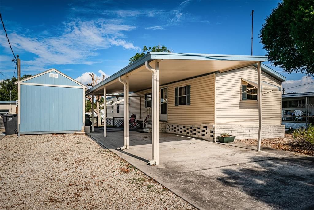 Driveway, carport, porch, storage shed. Freshly painted exterior.