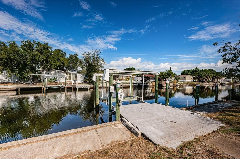 Dock with water & electric and Boat Lift. This saltwater canal leads to Tampa Bay.