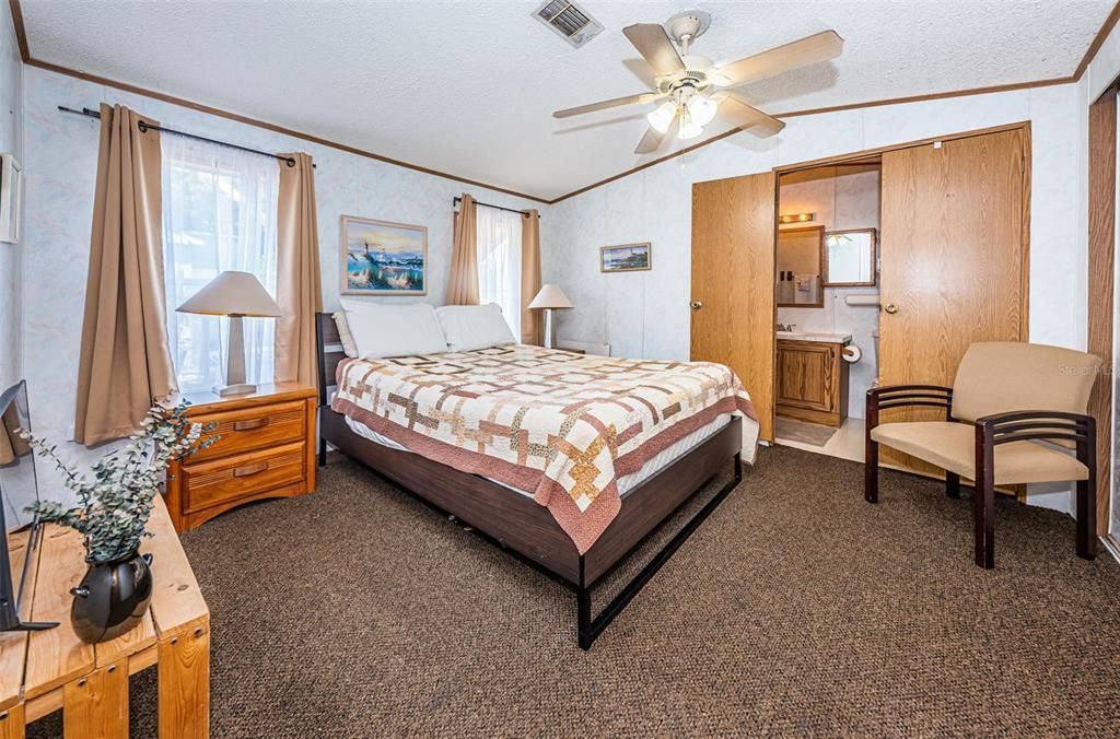 Primary Bedroom with Ceiling fan and private En Suite Bathroom