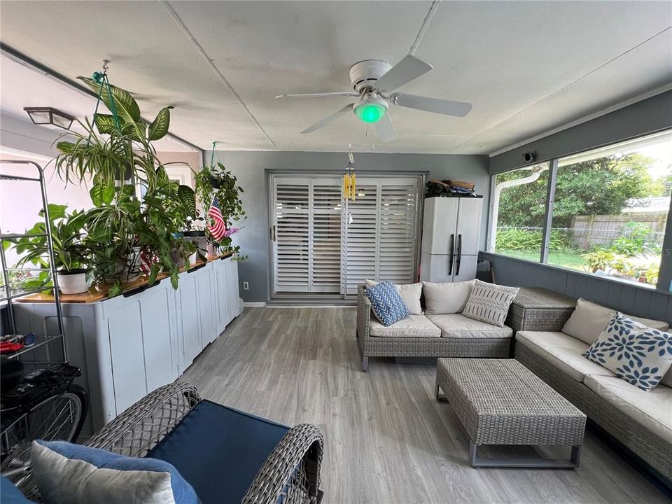 Fully Screened-In Florida Room off the Living Room with a Door to the Laundry Room (Florida room: 15X15)