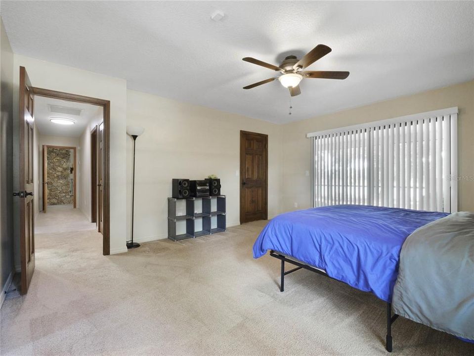 Primary Bathroom with sliding door to private patio area