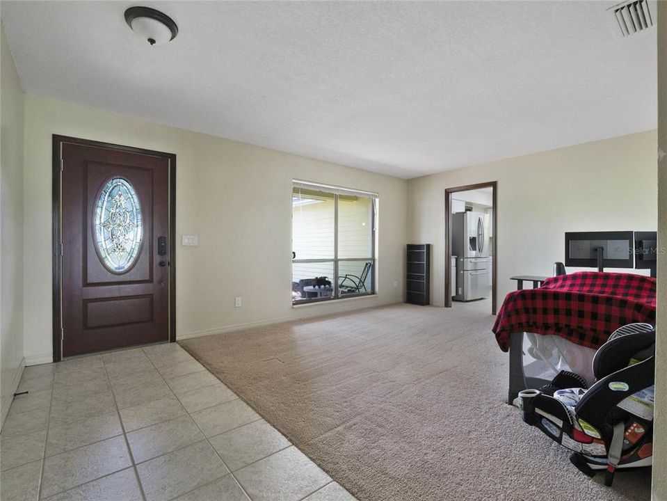 Family Room overlooking screened lanai and backyard