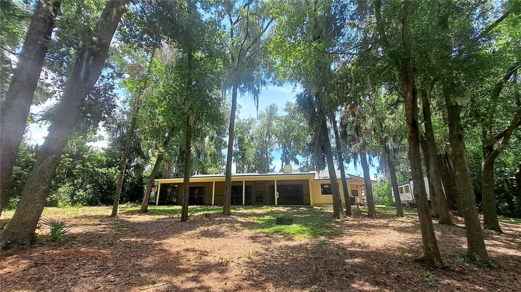 View of screened lanai from backyard