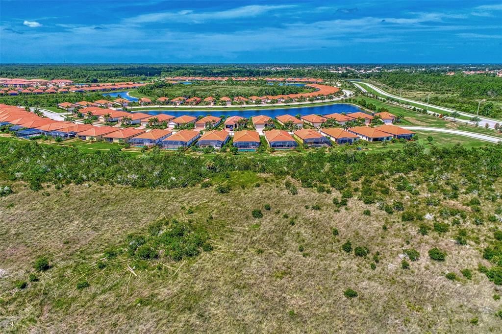 The back of the home faces the preserve - land dedicated to the environment and no one will ever build there.