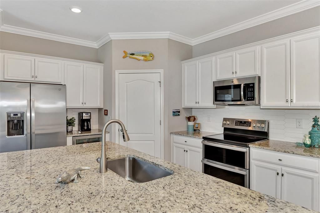 Walk In Pantry, is totally organized and has wooden shelves - not plastic coated.  The double oven is fabulous.  The lower oven can hold a full size Turkey and the smaller oven on top easily handles daily meals