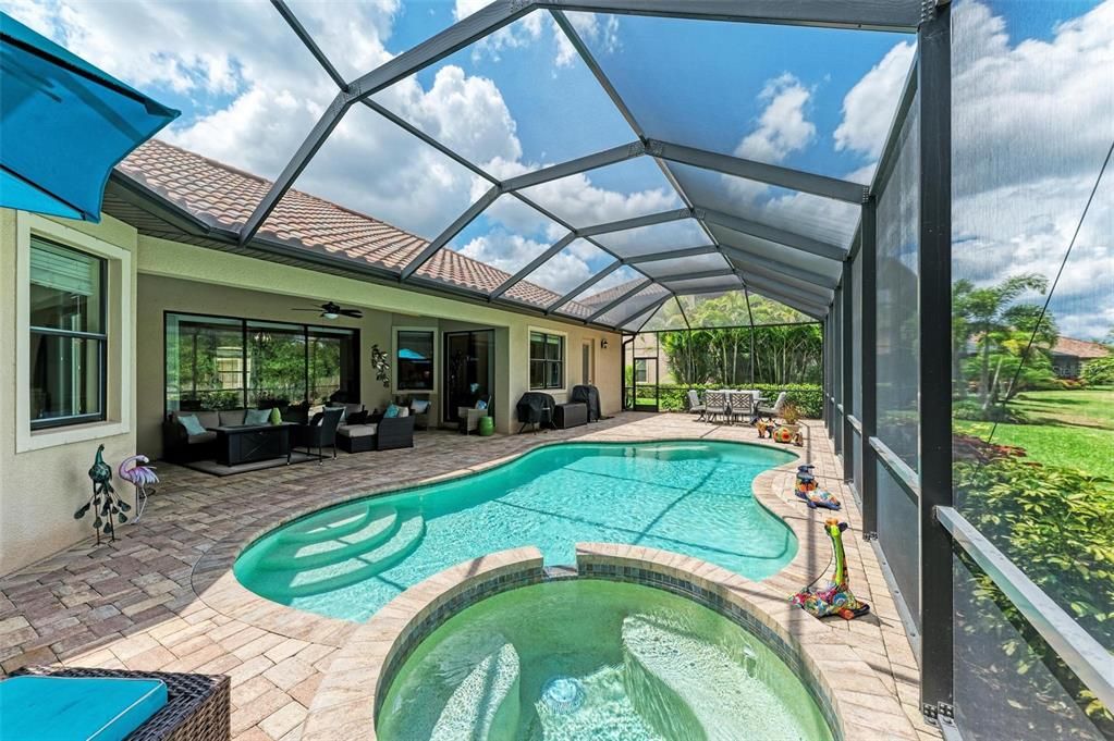 Large lanai with pool and hot tub over looking the preserve.
