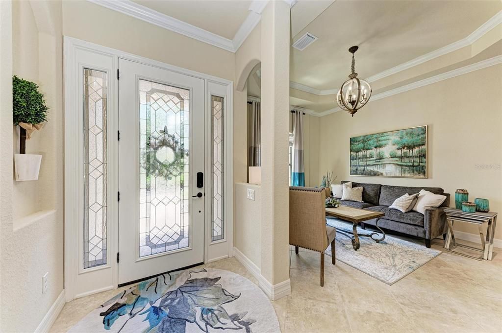 front door with transom windows to allow for plenty of natural lighting